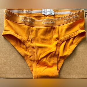 Men’s CK Yellow Briefs. Size Medium